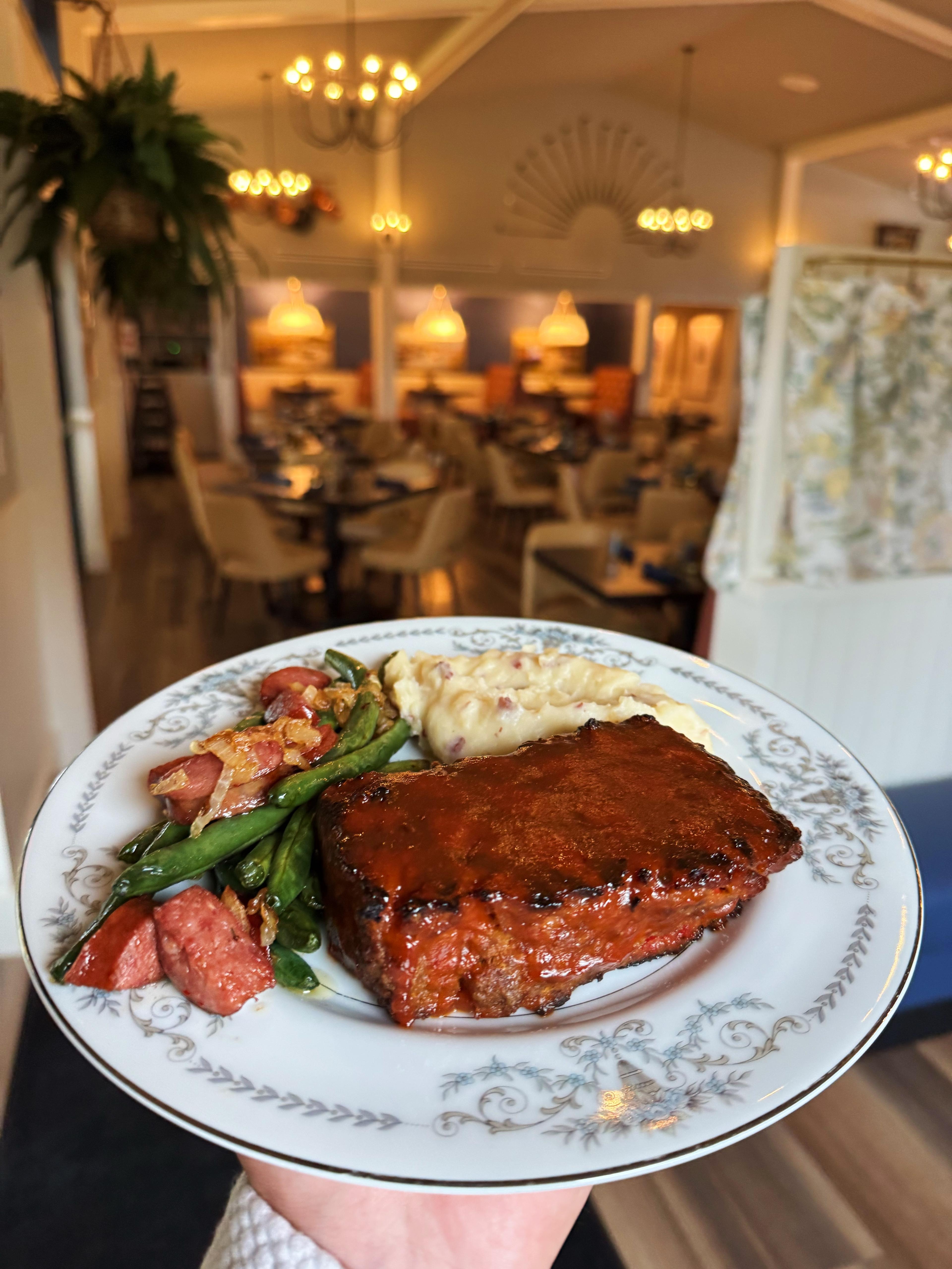 A plated rib dinner in the Fairways at GLC dining room