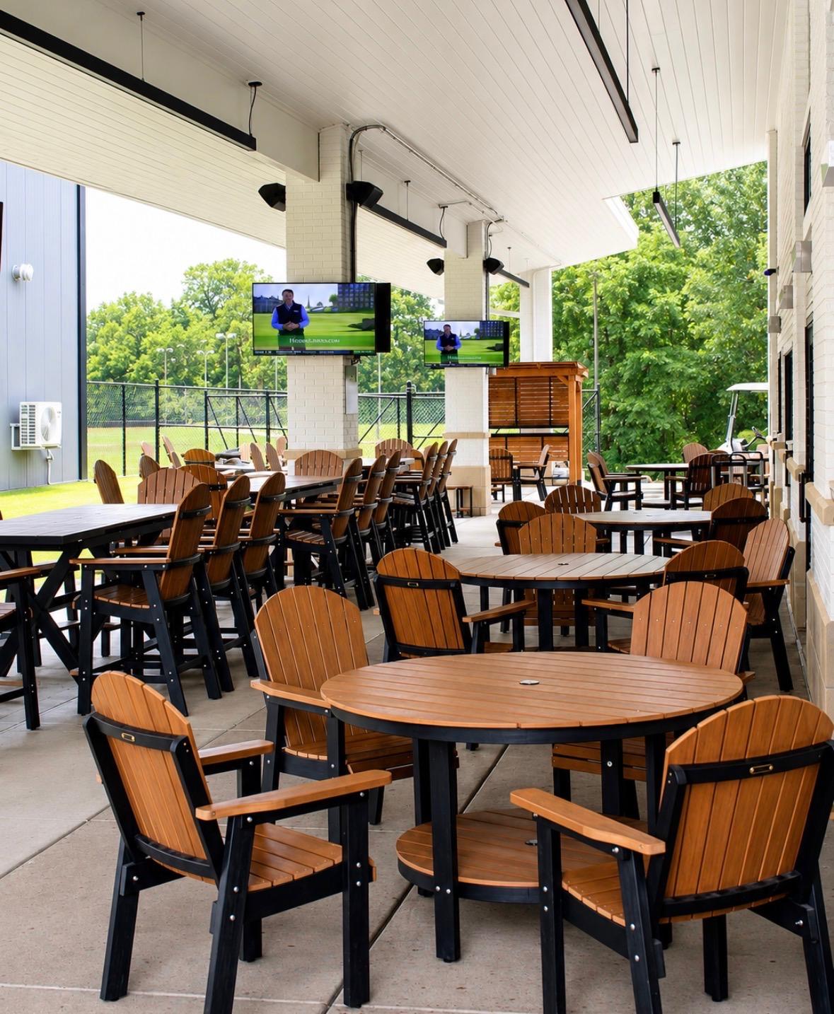 The large covered patio at Fairways at GLC with seating for groups